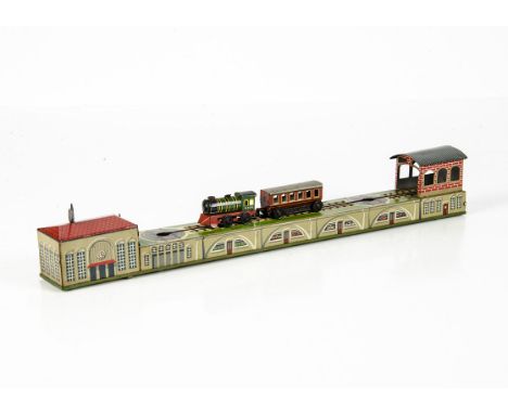 Arnold Tinplate Clockwork Shunting Train No 570, detailed tinprinted toy comprising train, carriage, engine shed and station,