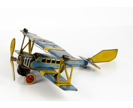 A Distler Tinplate Clockwork Bi-Plane, blue and yellow body with two pilots, 'JD 2755' markings to upper wing, detailed tinpr