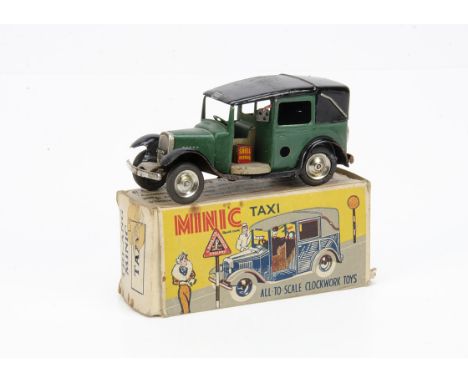 A Tri-ang Minic Tinplate Clockwork Pre-War 39M Taxi Cab, dark green body, black chassis and roof, petrol can, tin wheels, in 