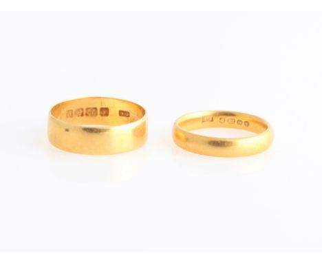 Two hallmarked 22ct yellow gold wedding bands, ring sizes L and P.