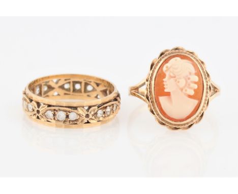 A cameo ring, stamped 9ct, together with a paste full eternity ring, indistinctly stamped, ring sizes P. (2).