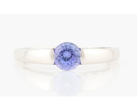 A hallmarked 9ct white gold tanzanite single stone ring, set with central round cut tanzanite, measuring approx. 5mm, ring si