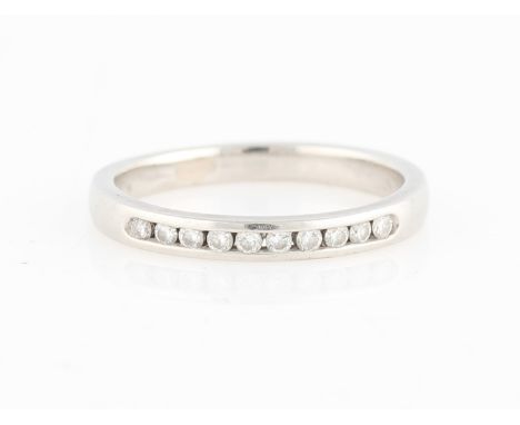 A hallmarked platinum diamond half eternity ring, channel set with ten round brilliant cut diamonds, total diamond weight app