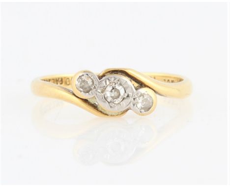 A three stone diamond ring, star set with three graduated eight-cut diamonds, total diamond weight approx. 0.10ct, in cross o