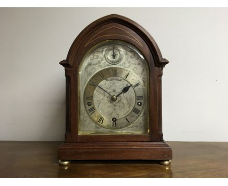 A Tiffany &amp; Co. New York mahogany cased mantle clock, with glazed panel glass front, silver engraved face with leaf desig