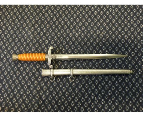 A Third Reich officers dagger engraved “E &amp; F Horster Solingen” with metal scabbard.