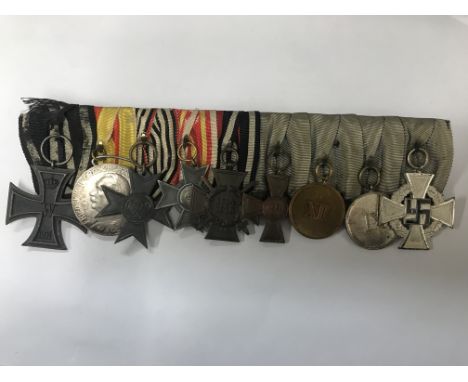 An medal group of nine First and Second World War medals to include the 1914 Iron Cross, the Merit Cross for War Aid and the 