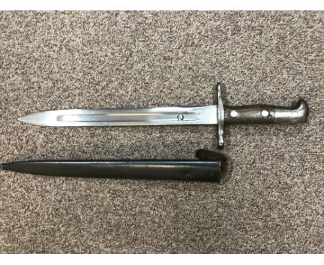 A late 19th Century German bayonet with wooden handle and metal scabbard, stamped "maschinenfabrik BERN" to blade.