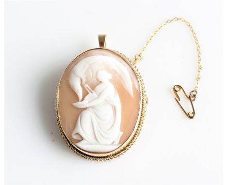 A hallmarked 9ct yellow gold framed cameo brooch/ pendant, featuring a full length ladies portrait, with attached safety chai