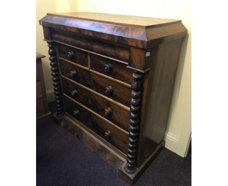 A late 19th Century mahogany chest of drawers with three long and two short drawers and secret drawer and bobbin turned colum