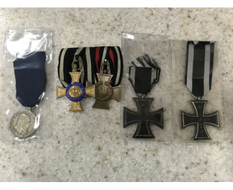 A First World War medal group of two together with two Iron Cross medals and one other medal.