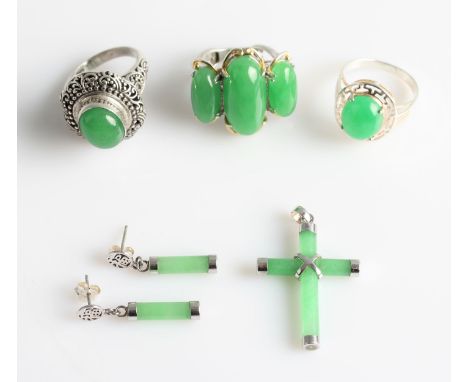 A collection of Oriental green hardstone jewellery, to include a three cabochon open metalwork ring, a single cabochon scroll