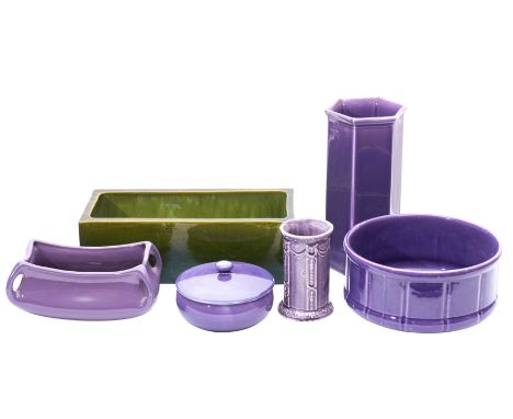 A Bretby green glazed flower trough, together with a small group of purple glazed earthenwares.