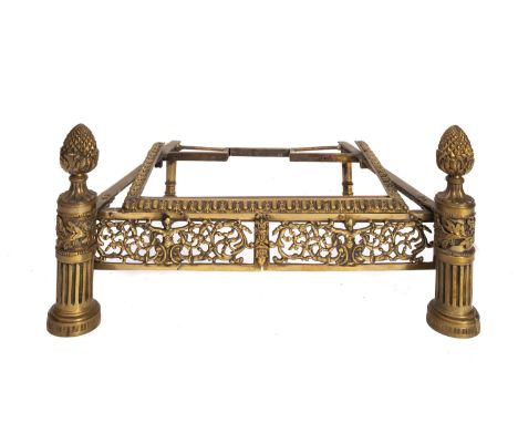 The stand for a 19th Century fire grate, the frieze pierced and decorated with figures and scrolling foliage flanked by cylin