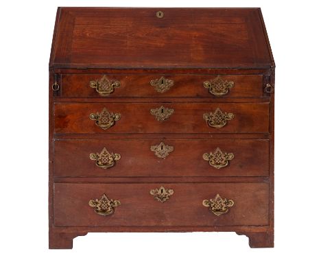 A George III mahogany bureau, circa 1770, the sloping hinged fall enclosing fitted interior with pigeon holes and small drawe