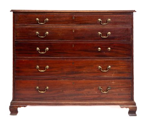 A George III mahogany secretaire chest, circa 1810, the top with a moulded edge, having a fall enclosing the inlaid fitted in