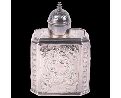 A Queen Anne silver tea caddy, Samuel Edlin, London 1709, later relief embossed foliate decoration with pull-off cap and slid