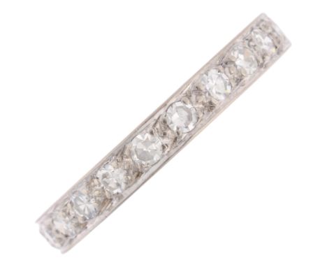 An Art Deco diamond half eternity ring, set with eight-cut diamonds and foliate engraved shank, total diamond content approx 