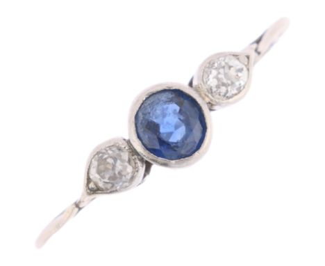 A platinum (tested) three stone sapphire and diamond ring, rub-over set with round-cut sapphire and old-cut diamonds, total d