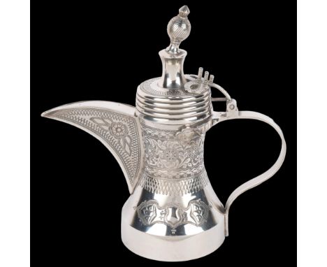 A heavy gauge Omani sterling silver Dallah coffee pot, Ayj Silver, relief embossed decoration, 26cm, 31.6ozKnop is pushed inw