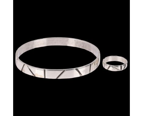 DEN-PERMANENTE - a Danish modernist sterling silver handicraft matching slave bangle and band ring, possibly designed by Kay 