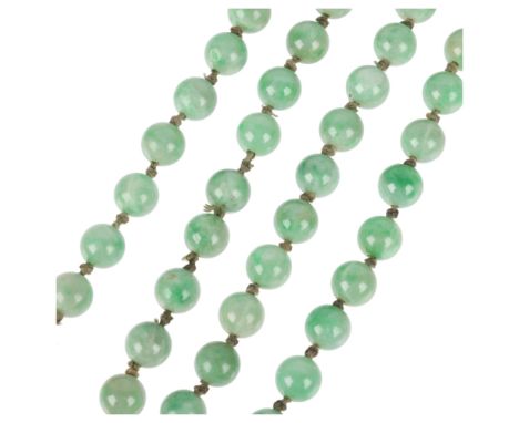A 9ct gold single-row jade bead necklace, 9.1mm individually knotted beads, 88cm, 99.6gNo major chips or losses, a few small 