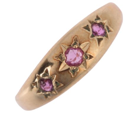 A 9ct gold three stone ruby gypsy ring, maker SDJ, Birmingham 1993, setting height 5.8mm, size N, 2gNo damage or repair, all 