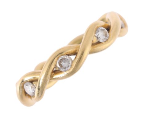 An 18ct gold four stone diamond infinity band ring, indistinct maker, Edinburgh 1996, band width 4.7mm, size L, 4.3gNo damage