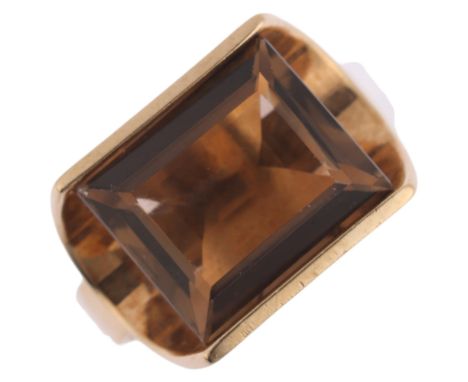 A modernist 9ct gold smoky quartz dress ring, maker DE, import London 1976, setting height 11.7mm, size M, 4.1gNo damage or r