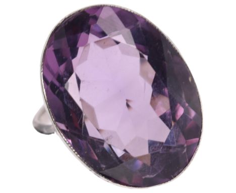 A large silver (tested) single stone amethyst ring, setting height 21.6mm, size K, 7.1gNo damage or repair, unmarked 