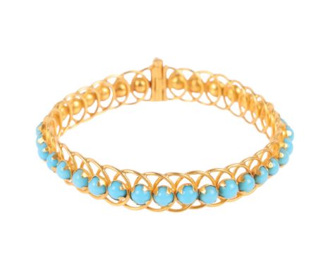 A Middle Eastern 22ct gold (tested) blue glass bangle, apparently unmarked, band width 11.2mm, internal circumference 18cm, 2