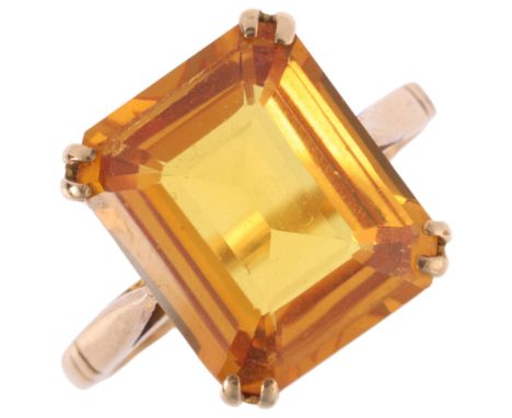 A 9ct gold yellow synthetic sapphire dress ring, indistinct maker, London 1963, setting height 12.2mm, size K, 3.4gNo damage 