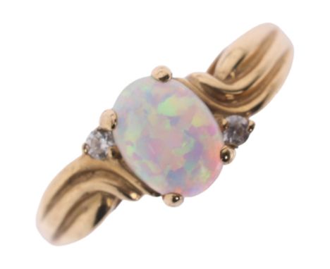 A 9ct synthetic opal and cubic zirconia dress ring, setting height 7.9mm, size P, 3.6gNo damage or repair, all stones present