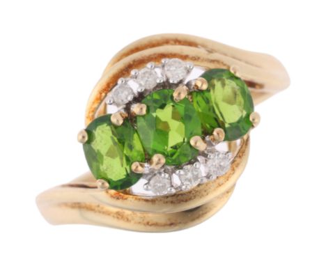 A 9ct gold green tsavorite garnet and diamond tourbillon ring, setting height 12.5mm, size M, 2.2gNo damage or repair, all st