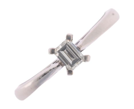 An 18ct white gold 0.2ct single stone diamond ring, claw set with rectangular step-cut diamond, colour approx J/K, clarity ap