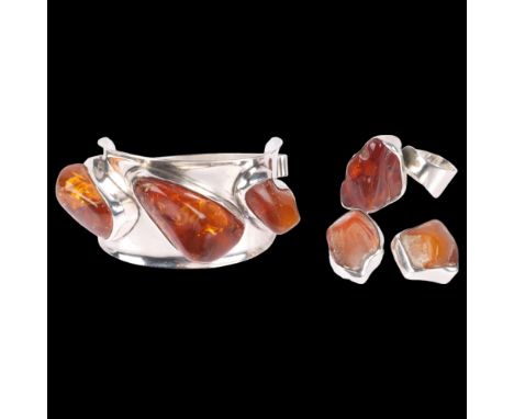 A Danish sterling silver and Baltic amber jewellery set, comprising torque bangle, ring and pair of clip-on earrings, bangle 