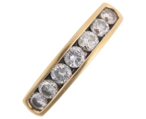 An 18ct gold seven stone diamond half eternity ring, maker LB Ltd, import London 1991, channel set with modern round brillian