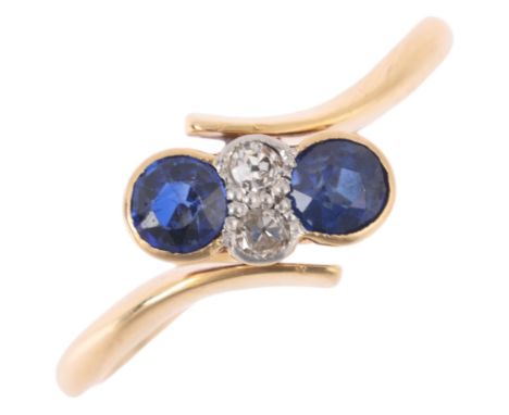 An Art Deco 18ct gold sapphire and diamond crossover ring, maker JH, platinum-topped set with round-cut sapphires and eight-c