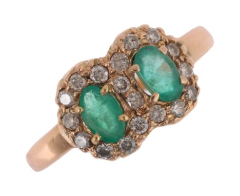 A late 20th century 14ct gold (tested) emerald and diamond double cluster ring, claw set with oval mixed-cut emeralds and mod