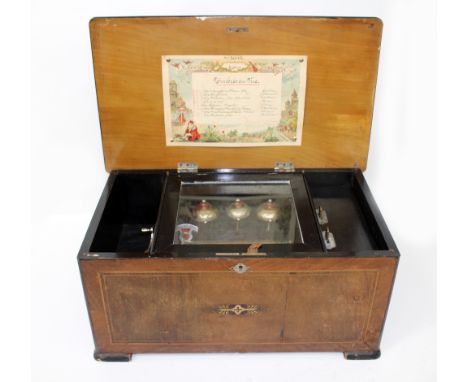 A LATE 19TH CENTURY SWISS WALNUT CASED MUSICAL BOX playing eight airs on a 16cm cylinder and three bells, 47cm wide x 27.5cm 