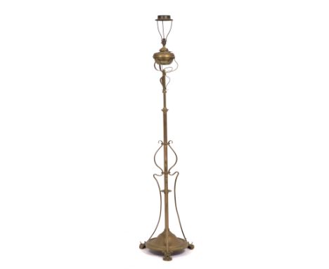 A VICTORIAN BRASS LAMP STANDARD later converted for electric use, approximately 182cm high overall (adjustable)