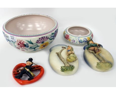 A POOLE POTTERY BOWL decorated with flowers, 24cm diameter together with a smaller Poole bowl, two Goebel wall pockets c.1958