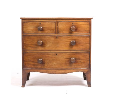 A VICTORIAN MAHOGANY BOW FRONTED CHEST of two short and two long drawers with turned knob handles and splayed bracket feet 89