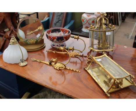 A BRASS HANGING LANTERN with scalloped glazing together with a brass wall light, further lighting, a pottery bowl, and a mirr