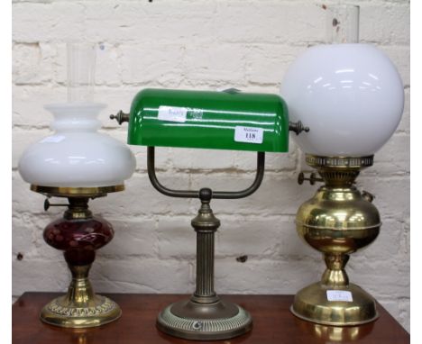 A BRASS DESK LAMP with a green glass shade 33cm in height together with two oil lamps (3)