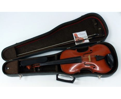 A MODERN ROMANIAN VIOLIN with two piece back, the back 45cm long together with a bow and violin case