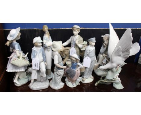 NINE LLADRO PORCELAIN FIGURINES to include a boy with a calf