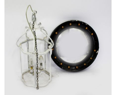 A LATE 19TH CENTURY CONVEX CIRCULAR WALL MIRROR with an ebony frame and gilded boule decoration 41cm diameter together with a