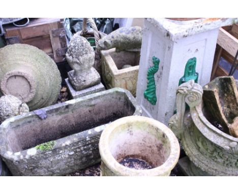 A SMALL COLLECTION OF GARDEN FIGURES AND ORNAMENTS to include a composite stone cat, a composite stone acorn, finials, recons