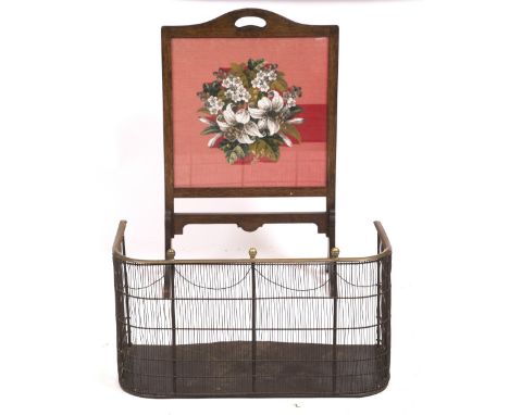 A GEORGIAN BRASS AND WIRE MESH FIRE GUARD 74cm wide x 36cm deep x 38cm high together with an oak fire screen with a embroider
